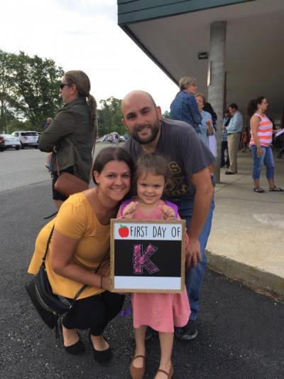 Jen and Danny Cordeiro pose for a photo with their daughter Layla, 5, who started her first day of kindergarten at the Potter School.