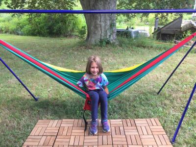Lila Soucy, 6, swings on a hammock at the campsite’s lounge area.