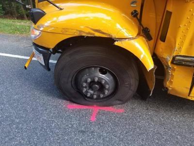 The left tire of the bus.
