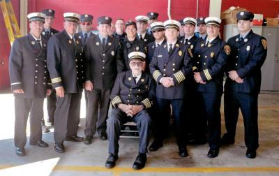 A more recent photo of retired Chief Mac with the district firefighters. Photo courtesy: Fire District No. 3