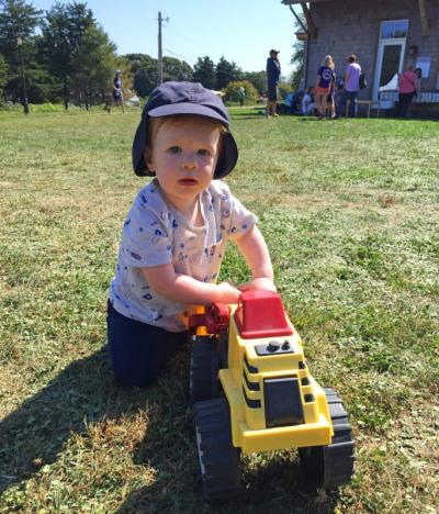 Otis Gerrior, 1, from Swansea, pushes a toy tractor.