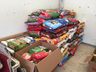Donated bags of dog and cat food are already piling up in the truck.