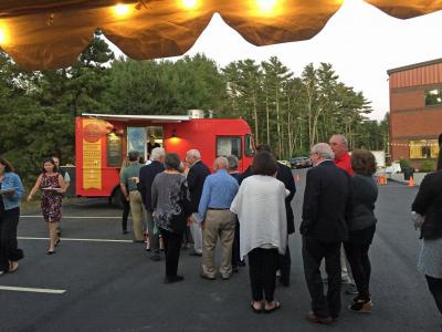 Guests lined up for a selection of entrees from Plouf Plouf food truck of Tiverton, RI.