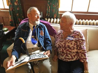 Philip “Russ” Cornell and Priscilla (Tavares) Mosher laugh at a picture of themselves at the Junior High Prom in their yearbook. They went together, and have been friends since first grade.