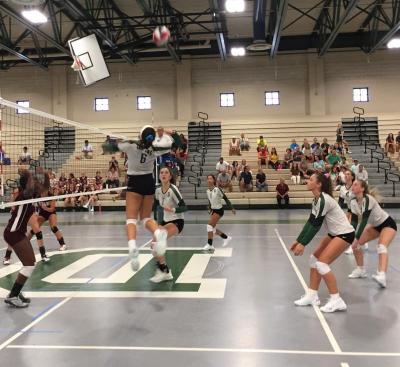 Kassidy Pratt leaps to hit the ball during the team’s first match against Bishop Stang on September 4. Dartmouth won 3-0. Photo by: Kate Robinson