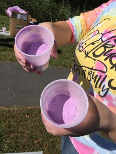 First grade teacher at Quinn Anne Realini readies her cups of colored corn starch.