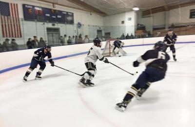 Dartmouth, MA news - sports - Nicolosi against three Foxboro players during the game
