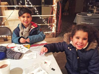 Dartmouth, MA news - Trent Tieu, 6, and Tatiana Pereira, 4, make crafts at Santa’s workshop.