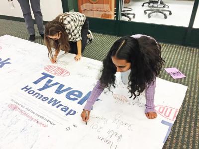 Students signed the back of the Poetry Out Loud poster after the competition - Dartmouth, MA news