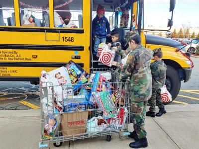 Dartmouth, MA news - Members of the South Coast Young Marines unloading toys. Photo courtesy: Dartmouth Police Department
