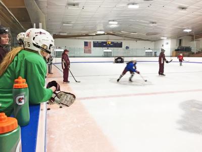 Dartmouth, MA news - Sara Mullin looks on as her teammates scrimmage