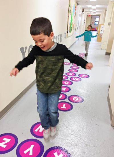 Dartmouth, MA news - Ferreira jumps on the alphabet section of the sensory path