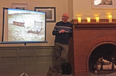 Phil Mello showing a photo of a “flower bed” on the island during the illustrated talk at the Olde Southworth Library
