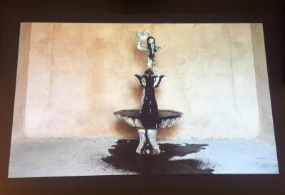 A video in the upper gallery by Hamed Noori shows oil spilling out of a fountain, eventually filling the screen