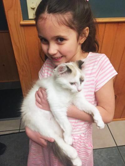 Dartmouth, MA news - Six-year-old Elizabeth Frasier holds Phoenix. Photo courtesy: Eileen Frasier