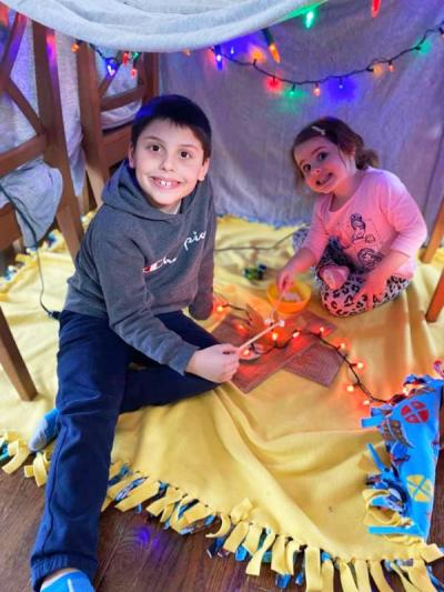 Aydan Costa, 7, with little sister Kayla, 3, in their “Fort Costa”. Photo courtesy: Heather LHeureux-Costa