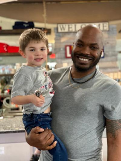 Dartmouth, MA news - Former Patriots linebacker Eric Martin with four-year-old heart surgery candidate Hunter Peets the day before the fundraiser. Peets is holding Martin’s Super Bowl XLIX ring. Photo courtesy: Nicky Peets