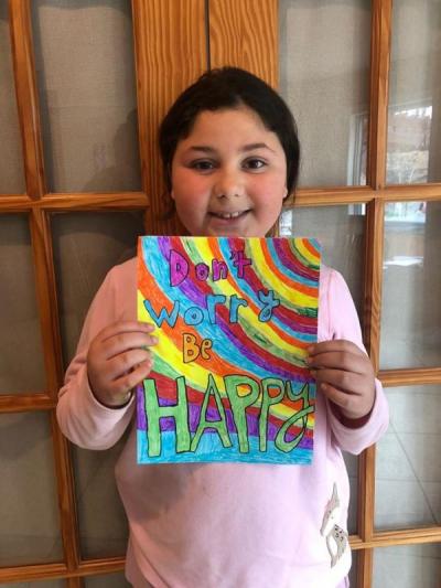 Dartmouth Week - Dartmouth, MA news - Third grader Sophia Medeiros with her quote for the police department’s page. Photo courtesy: DPD