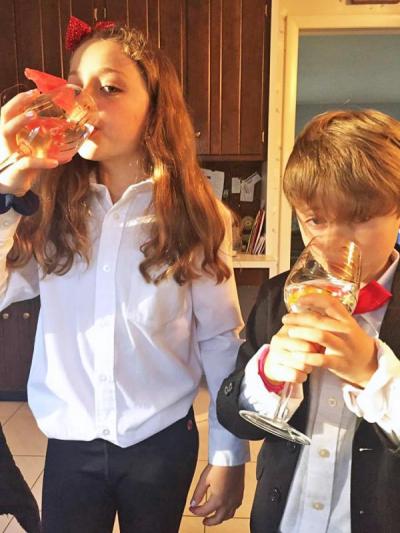 Third grader Charlee and first grader Pierce Norton of Quinn School sampled fruit-infused sparkling water. The pair won "cutest dinner duo”. Photo courtesy: Karee Norton