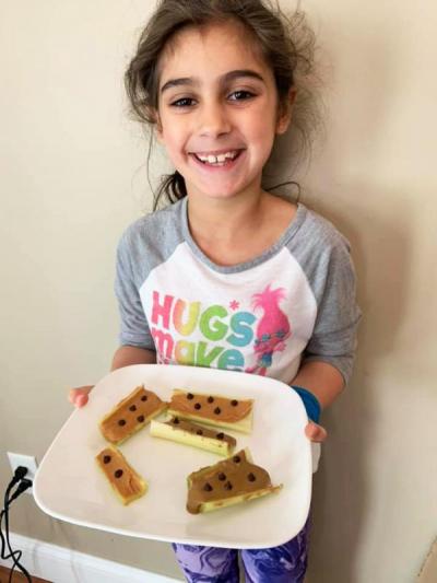 Leah Margarida, second grade at Potter School, won "cutest snack" for her bugs on a log dish. Photo courtesy: Sarah Margarida