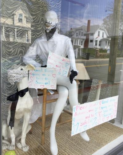 Dartmouth Week - Dartmouth, MA news -  A masked mannequin (and canine companion, also masked) in a shop window ask people to “Please social distance, stay home, and be safe!”