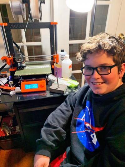 Tyler with his 3D printer. Photo courtesy: Tracie Ferreira