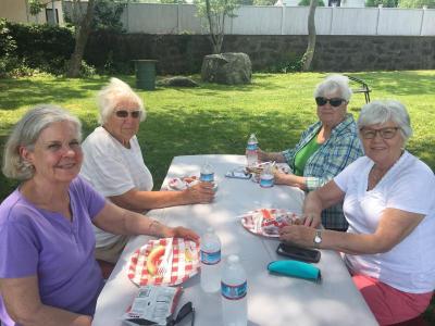 Enjoying the festivities are, clockwise from lower left, Marcella O’Connor, Frances Mills, Elena Aubertine and Virgie Oliveira.
