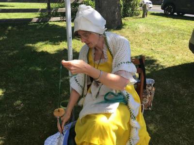 Elizabeth Chadwick of Spinners with Soule demonstrates the drop spindle, a rudimentary way to spin fiber into yarn.
