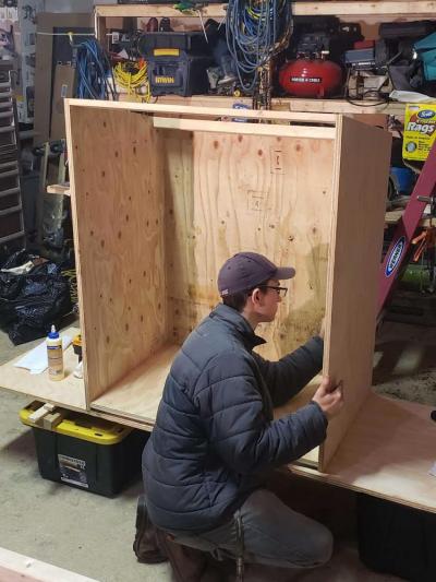 Zachary Joubert with the blessing box he constructed for the Smith Mills Congregational Church. Photo courtesy: Joubert family.