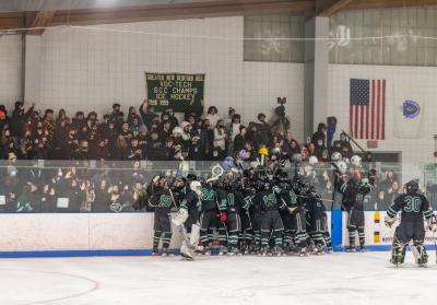 Dartmouth players celebrate their victory, crowding around the student section just after time expired.