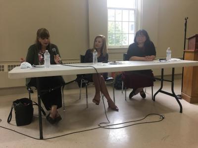From left, Corinne Williams, executive director of the Community Economic Development Center in New Bedford; Helena DaSilva-Hughes, president and CEO of the Immigrants Assistance Center in New Bedford; and Mali Lim, who works with the refugees as a team leader for the Southcoast Afghan Welcome Network, speak at a forum on immigration. Photo by: Sandy Quadros Bowles