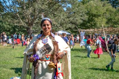 Kendall Scott of the Mashpee Wampanoag poses for a photo in her traditional regalia at the “Wampanoag Experience Powwow” at Round the Bend Farm on Sept. 17. Photo by: Morgan Beard
