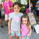 Sophia Baker, 8, and her sister Julia, 2, after getting their faces painted