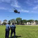 State police watch the helicopter take off at Ashley Park.