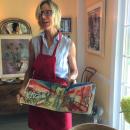 Gillies showing her sketch books in her historic house
