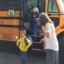 Lincoln Wilkins, 6, steps off the bus for his first day of first grade at the Potter School.