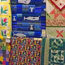 Multicolored quilts from the Paskamansett Quilters on display at the fair.