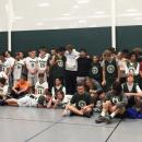 Both Dartmouth and Dighton-Rehoboth United basketball teams posing for a photo after the game.