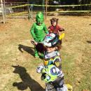 Connor Smith, 4, dressed as Voltron, runs from four-year-old Isaac Viveiros and two-year-old werewolf CJ Gonsalves.