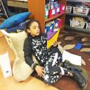 LeeAna Matthews, 8, reclines while reading.
