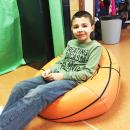 Gianni Rogers, 8, on a beanbag chair.