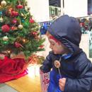 Charlie Webb, 2, can’t decide between popcorn and a lollipop at Milbury.