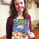 Dartmouth, MA news - Christmas at Southworth Library - Children’s Librarian Christie Phillips shows the book she read to the kids: ‘Olive, the Other Reindeer’.