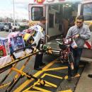 Emergency responders unloaded toys from an ambulance. Photo courtesy: Dartmouth Police Department - Dartmouth, MA news