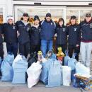 Detective Kyle Costa (center) with members of the Dartmouth High School hockey team and their bags of toys. Photo courtesy: Dartmouth Police Department - Dartmouth, MA news