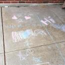 At Potter, a bucket of chalk was left outside along with gifts and books for kids and families to take. Messages of love to teachers and classmates fill the walkway