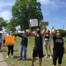 Dartmouth Week - Dartmouth, MA news - New Bedford residents Jeffrey Medeiros and Nilia Parreira-Morgado at the protest