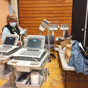 Dartmouth Week - Dartmouth, MA news - Janet Macedo of Southcoast Health checks on the EKG machines. Photos by: Kate Robinson