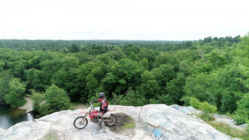 A dirtbike rider poses atop a rock formation at Freetown-Fall River State Forest. COURTESY ANTHONY FRANCO