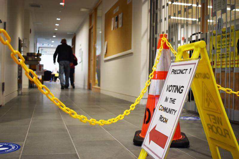 A couple of voters head into their precinct at the North Dartmouth Library to cast their ballots in last year’s town election. Photo by: Christopher Shea